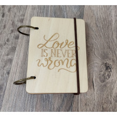 Wooden notebook A7 "Love is never wrong" made of plywood Light on rings
