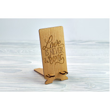 Stand for phone "Love is never wrong   " from a natural wood