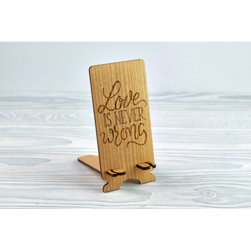 Stand for phone "Love is never wrong  " from a natural wood