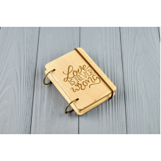 Pocket notebook made of wood A7 on rings "Love is never wrong"