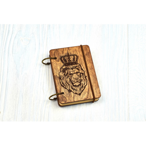 Pocket notebook A7 "Lion" Dark of plywood on the rings, 60 sheets