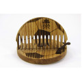 Round comb for a beard Football made of natural wood in a holder