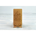 Stand for phone "Love is never wrong  " from a natural wood