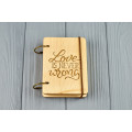 Pocket notebook made of wood A7 on rings "Love is never wrong"